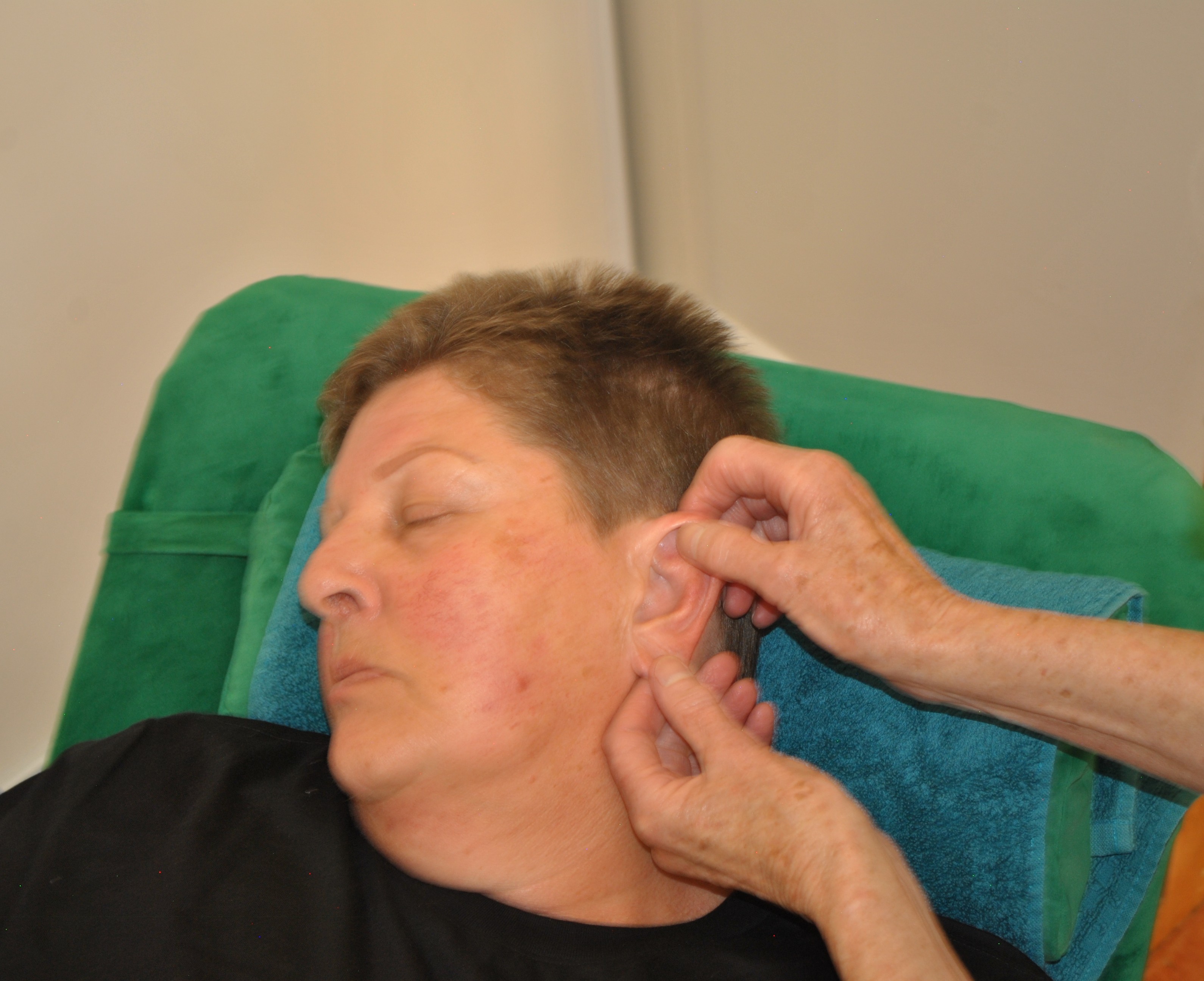 Nonie performing ear reflexology
